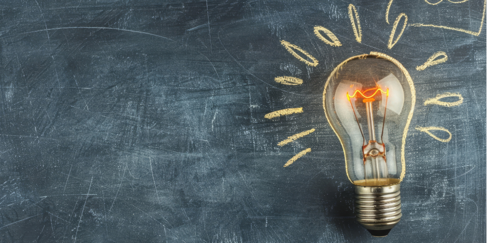 picture of a blackboard with chalk and a lightbulb